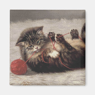 Aimant Le berceau de chat, un chat qui joue à la balle de