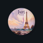 Aimant Paris Eiffel Tower France Sunset Watercolor Travel<br><div class="desc">A luminous watercolor illustration of the Eiffel Tower in Paris, France, set against a radiant sunset sky with shades of lavender, blush, and gold. The scene captures the bridge over the Seine River, where gentle reflections of the tower and lamplights shine on the water’s surface. Architectural details and soft pastel...</div>