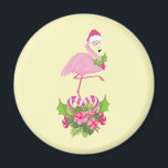 Aimant Pink Flamingo in Santa Hat Whimsical Christmas<br><div class="desc">A magnet with a tropical themed Christmas flamingo wearing a pink santa hat. Underneath its feet is a candy cane bouquet with pretty tropical flowers and pink berries. A sprig of holly on its chest.</div>