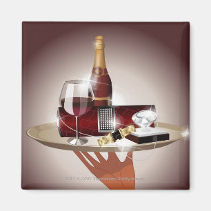 Aimant Plan rapproché de la main d'un serveur tenant un