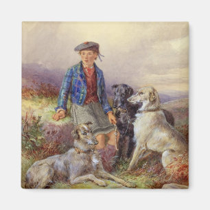Aimant Scottish boy with wolfhounds in a Highland landsca