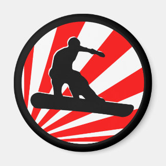 Aimant snowboard. rayons rouges.