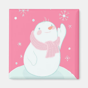 Aimant Un bonhomme de neige atteignant pour un flocon de