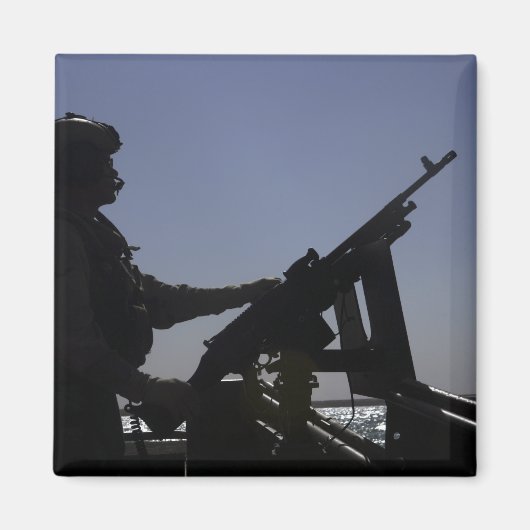 Aimant Un technicien maniant une mitrailleuse M240 en Ira (Devant)