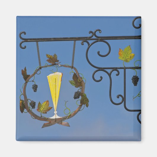 Aimant Une enseigne en fer forgé qui illustre le thème (Devant)