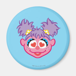 Aimant Visage souriant Abby aux yeux en forme de coeur