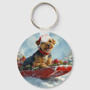 Airedale-hond in slee laat het sneeuwen Kerstmis Sleutelhanger