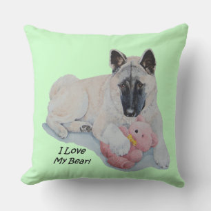 Akita-hond die roze teddy met een huisschild bedek kussen