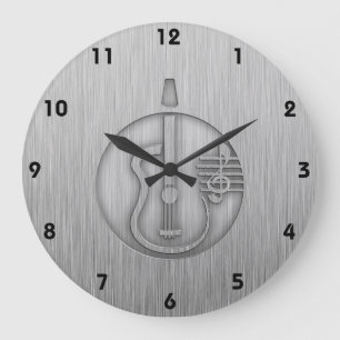 akoestische gitaar; blik van geborsteld metaal grote klok