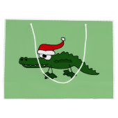 Alligator drôle dans le sac de cadeau de Noël de (Dos)