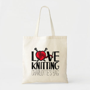 Amour nommé tricotant le sac rouge