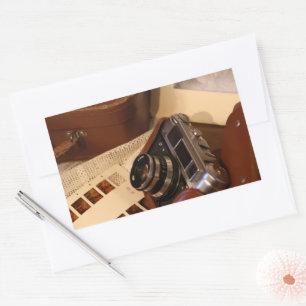 analoge camera in leder bruin hoesje rechthoekige sticker