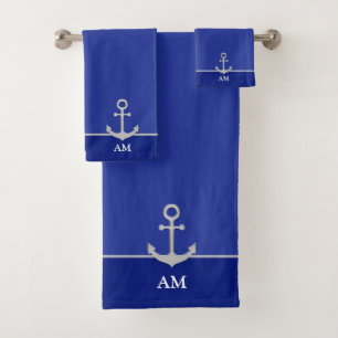 Ancre argentée et monogramme sur fond bleu foncé