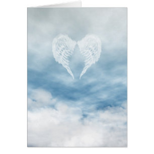 Angel Wings in Cloudy Blue Sky