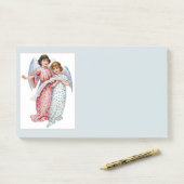 Angels En Pink Et Bleu Post-it Notes (Sur un bureau)
