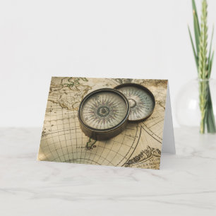 Antique compass on map kaart
