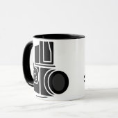 Appareil-photo. Tasse (Devant gauche)