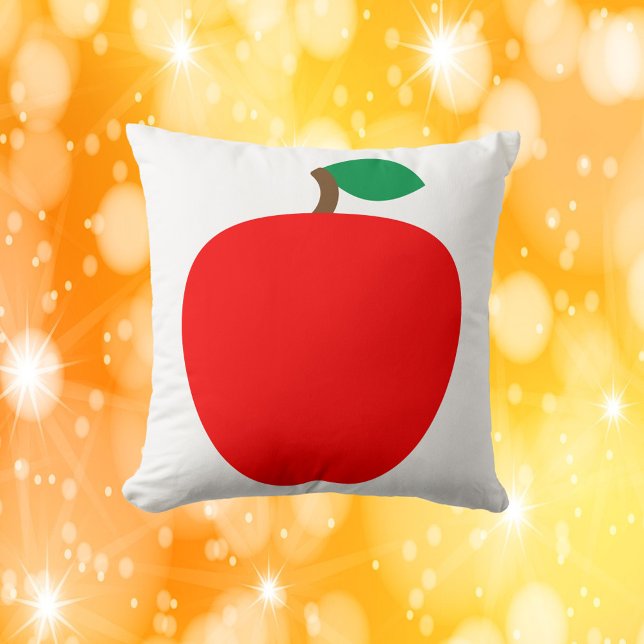 appelrood fruit kussen (A throw pillow with a graphic of a red apple.)