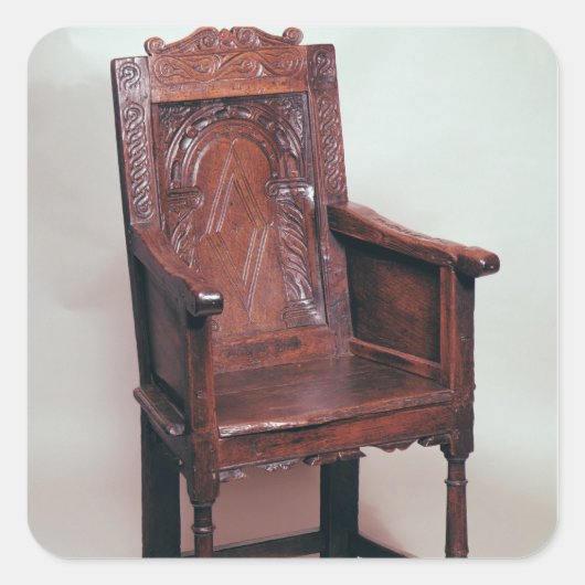 Armstoel met achterzijde en in dozen gearceerde zi vierkante sticker (Voorkant)