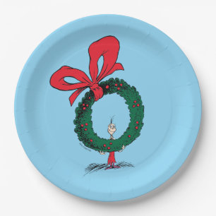 Assiettes En Carton Qui regarde à travers la couronne de Noël