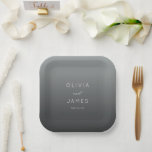 Assiettes En Carton Sophisticated Gray Minimalist Wedding<br><div class="desc">This elegant wedding plate features a minimalist design with a gradient gray background that transitions from light to dark. The layout is centered, showcasing bold, uppercase names in a clean sans-serif font, complemented by a stylish cursive "and" for added sophistication. Below the names, the date is presented in a lighter...</div>