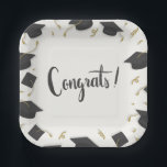 Assiettes En Carton White Cap & Confetti Graduation Congrats<br><div class="desc">🎓Celebrate your graduate’s big moment with these stylish White Cap & Confetti Graduation Congrats Paper Plates. Designed with a clean white background and accented by a festive border of black graduation caps and shimmering gold streamers, these plates bring a bright, modern touch to any commencement celebration. The elegant “Graduation” script...</div>