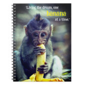 Baby Monkey eet banaan Notitieboek (Voorkant)