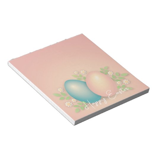 Babyblauwe en roze eitjes en lentemeel notitieblok (Schuin)