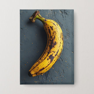Badge Banane exotique posée sur une surface grise