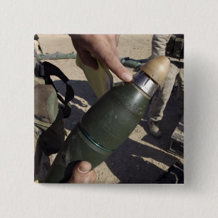 Badge Carré 5 Cm Un chef d'équipe indique un délai