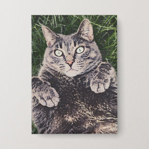 Badge Chat allongé dans l'herbe