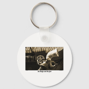 BADGE EN PISTOOL SLEUTELHANGER