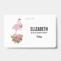 Flamant rose avec un chapeau de Père Noël et bouqu