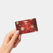 Badge Flocons de neige dorés de Noël sur fond rouge (Manuel / portable)