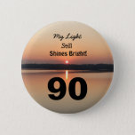 Badge Rond 5 Cm 90th Birthday My Light Still Shines Bright Button<br><div class="desc">Give a happy 90th birthday button to express his “My Light Still Shines Bright” sentiment. A bold design with a black and gold sunrise on a peaceful lake sends a message of encouragement and love. An endearing verse for an inspiring ninetieth birthday celebration.</div>