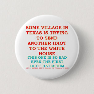 BADGE ROND 5 CM IDIOT DE VILLAGE DE COWBOY DE RICK PERRY