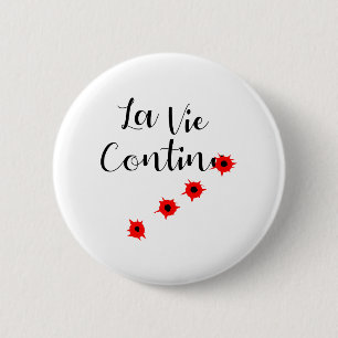 BADGE ROND 5 CM LA VIE CONTINUE