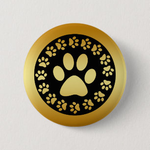 BADGE ROND 5 CM OR ET EMPREINTES DE PATTES NOIRS