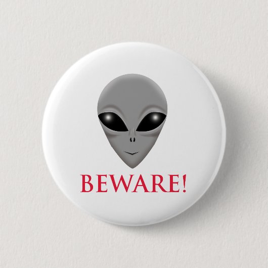 BADGE ROND 5 CM PRENEZ GARDE DE L'ALIEN (Devant)
