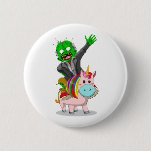 Badge Rond 5 Cm Un Zombie vert est à cheval sur une licorne rose m