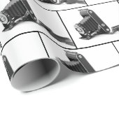  balgcamera op wit cadeaupapier (Rol Hoek)