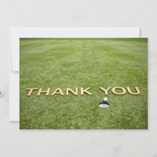Balle de golf avec le texte Merci sur de l'herbe v (Devant)