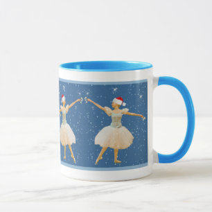 Ballerine de Noël avec la tasse de castagnettes