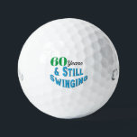 Balles De Golf Funny Golf Balls 60e anniversaire<br><div class="desc">Célébrez le 70e anniversaire d'un golfeur en style avec Funny Golf Balls 70e édition anniversaire. Ces balles de golf font un cadeau amusant et unique pour tout passionné de golf qui atteint cet âge marquant. Avec l'inscription ludique "70 ans et toujours en mouvement !" ces boules ajoutent une touche d'humour...</div>