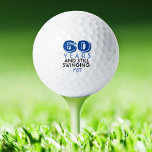 Balles De Golf Funny Golf Balls 60e fête d'anniversaire Monogramm<br><div class="desc">Votre golfeur qui aura 60 ans se fera un plaisir de ces balles de golf personnalisées. Dispose d'un design avec le texte "60 ans et toujours en mouvement". (Vous pouvez changer le nombre en n'importe quelle année.) Personnalisez avec des initiales monogrammées, le nom ou la date. Parfait pour un cadeau...</div>