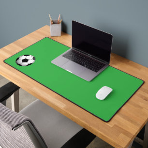 Ballon de football sur fond vert