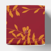 Ballotins Feuilles de branches de silhouette orange sur roug (Haut)