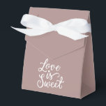 Ballotins Mariage minimaliste rose gold et blanc<br><div class="desc">Des sacs de cadeaux de mariage époustouflants de couleur rose gold qui feront ressortir votre cadeau. Chaque sac est orné d'une inscription romantique 'L'amour est doux', ajoutant un charme délicat et un style unique à votre cadeau. Rendez votre cadeau encore plus spécial avec nos exquis sacs de cadeaux de mariage....</div>