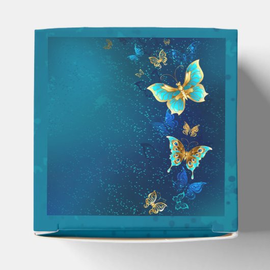 Ballotins Papillons d'or sur un Arrière - plan bleu (Haut)