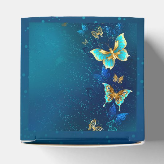 Ballotins Papillons d'or sur un Arrière - plan bleu (Haut)